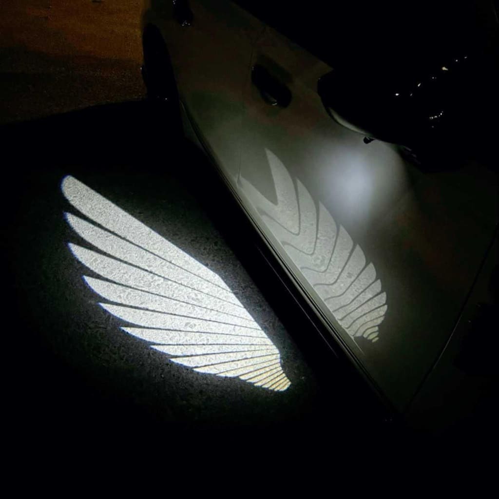 Projecteurs de sol effet « Ailes d'ange » exclusifs pour Cadillac